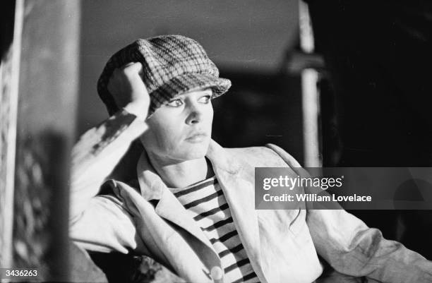 French actress Brigitte Bardot wearing a boy's cloth cap during the filming of Louis Malle's 'Viva Maria!' in Mexico.