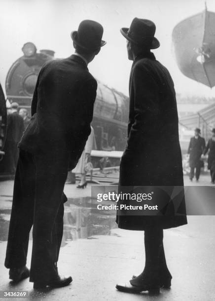 Dignitaries of St Paul's Church look at an engine on display in the Transport Pavilion on the day that the King officially opens the Festival of...