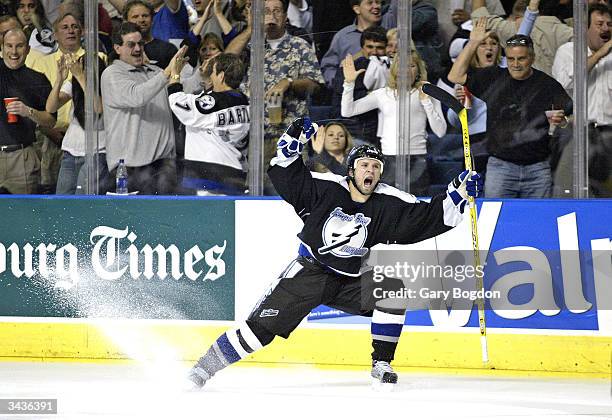 Martin St. Louis of the Tampa Bay Lightning celebrates his game winning goal over the New York Islanders during overtime in the first round of the...