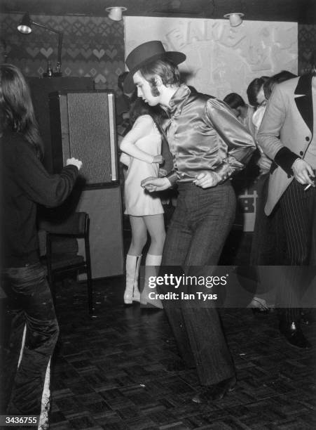 Dancers at 'The Speakeasy' a London nightclub near Oxford Circus which has an entrance hall decortated like a funeral parlour with a coffin as the...