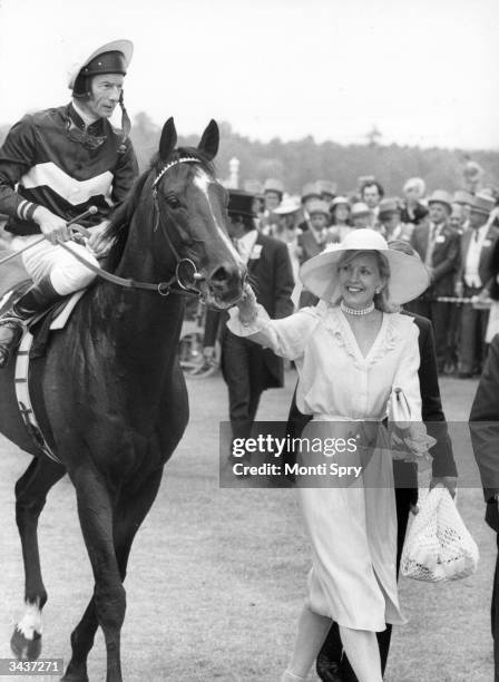 Mrs St George leads in her husband's horse 'Ardross' after it won the Gold Cup at Royal Ascot, Lester Piggott up.