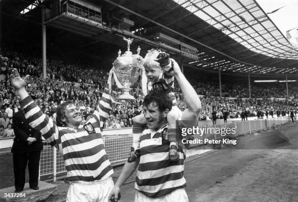 Kevin Ashcroft and Peter Smethurst carry 4 year old mascot Gary Ashcroft aloft after Leigh win the Rugby League Challenge Cup, beating Leeds in the...