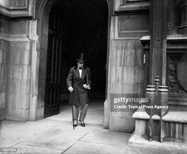 Cinematograph actor portrays British prime minister Benjamin Disraeli leaving the House of Commons in London.