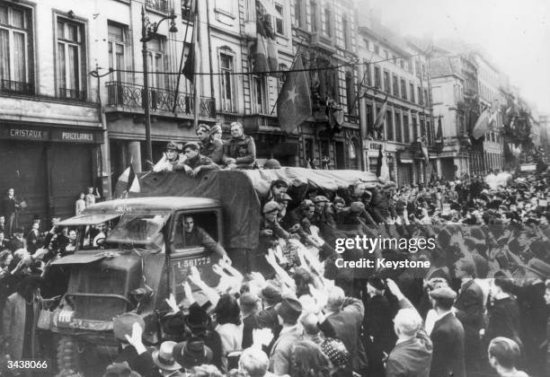 Belgian Brigade is welcomed by hundreds of people as they drive down the Rue Royale, Brussels during the liberation of the city by Allied forces.