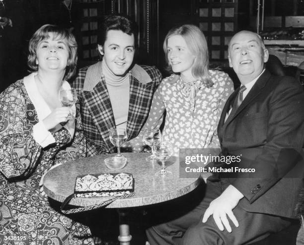 Former Beatle Paul McCartney with his wife Linda , his father James and his stepmother Angela.