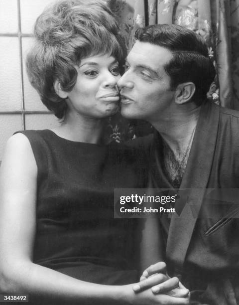 Welsh cabaret singer Lorne Lesley with British actor and singer Frankie Vaughn in Vaughn's dressing room at the London Palladium, where he is...