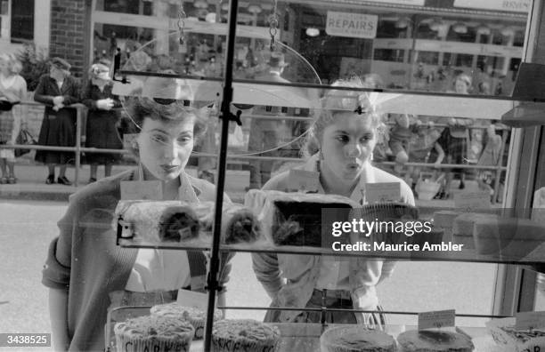 Slimmers sharing the ordeal of a nine-day diet at a health farm can only stare through a shop window at a tempting array of forbidden cakes. Original...