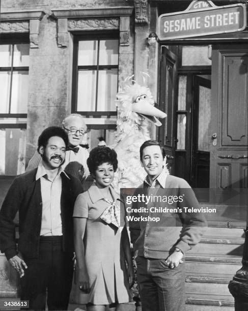 Hosts of the television show, 'Sesame Street' pose on the set with Big Bird. Left to right: Matt Robinson , Will Lee , Loretta Long and Bob McGrath.