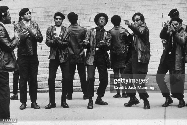 Members of the Black Panther party demonstrate outside the Criminal Courts Building one month after 21 Panthers were charged with plotting to...