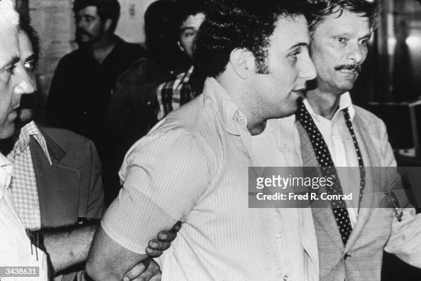 American serial killer David 'Son of Sam' Berkowitz being taken into police custody, New York City.
