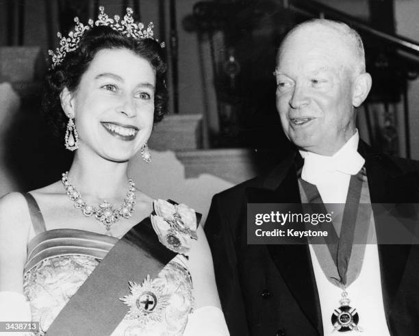 Queen Elizabeth II with US president Dwight D Eisenhower at a White House State banquet. Eisenhower is wearing the British Order of Merit awarded him...