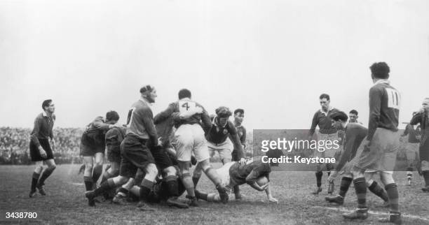 Daly of Ireland crawls out of a scrum with the ball during an Ireland v Wales match in Belfast. Ireland won the match.