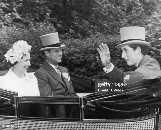Prince Charles, Queen Elizabeth II and the Duke of Edinburgh pass through the village of Cheapside on their way to the Ascot race meeting, 18th June...