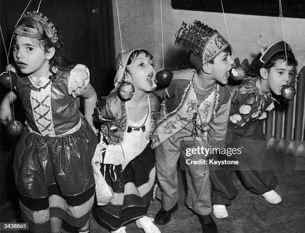 From left to right, Elizabeth Bianco, Barbara Lee, Anthony Dimino and Theresa Imbronone join in the fun at a Halloween party in New York City. The...