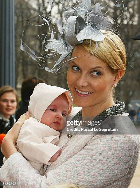 Crown Princess Mette-Marit holding Princess Ingrid Alexandra as they arrive at the christening of Princess Ingrid Alexandra - daughter of Crown...
