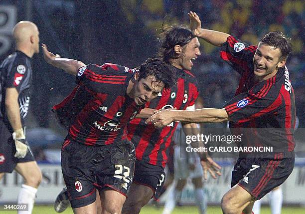 Milan's Brazilian midfielder Ricardo Kaka is congratulated by teammates Ukrainian striker Andryi Shevchenko and captain Paolo Maldini after scoring...