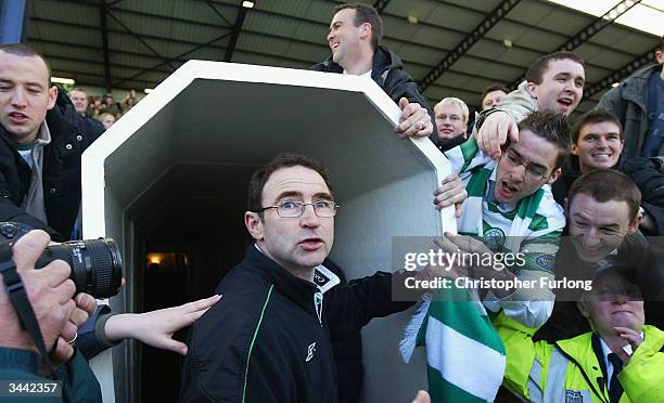 Celtic manager Martin O'Neill is mobbed by supporters at the end of the Scottish Premier League match between Kilmarnock and Celtic at Rugby Park on...