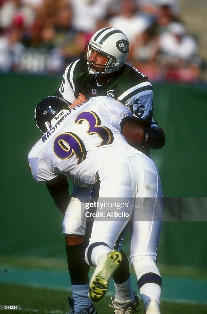 Quarterback Vinny Testaverde of the New York Jets is tackled by