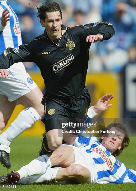 Celtic's Jackie McNamara gets brought down by Kilmarnocks David Lilley during the Scottish Premier League match between Kilmarnock and Celtic at...