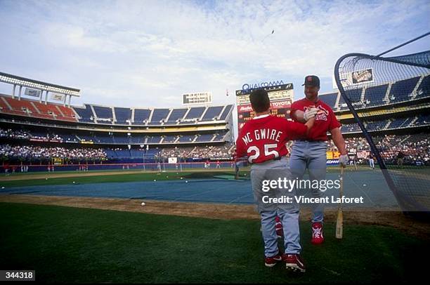 Mark McGwire of the St. Louis Cardinals and his son Matthew shake hands prior to a game against the San Diego Padres at the Qualcomm Stadium in San...