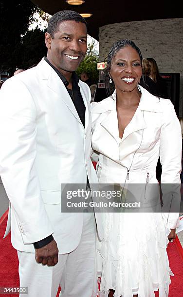 Actor Denzel Washington and his wife Pauletta attend Regency Enterprises and Twentieth Century Fox's "Man on Fire" Premiere at Mann National Theatre...