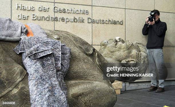 Statue of former Soviet leader Josef Stalin is ferried into Bonn's History Museum 19 April 2004. The 3.42-metre-high stone statue weighing in at 3.2...