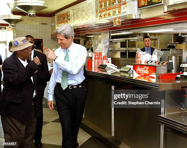 Democratic presidential hopeful U.S. Senator John Kerry gives a local supporter a thumbs up inside the Varsity diner, a famous local landmark April...