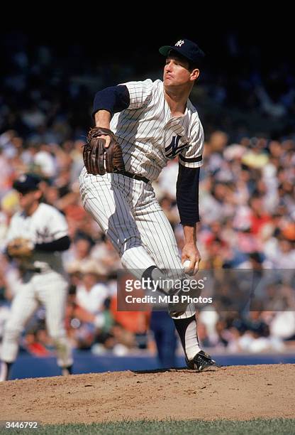 Tommy John of the New York Yankees on the mound during his tenure as a pitcher for the Yankees circa 1979-82 or 1986-89 at Yankee Stadium in the...
