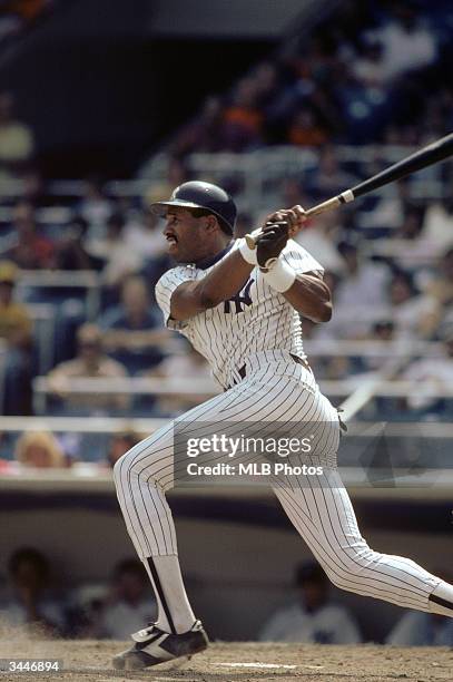 Dave Winfield of the New York Yankees swings at a pitch during a 1984 season game at Yankee Stadium in the Bronx, New York.