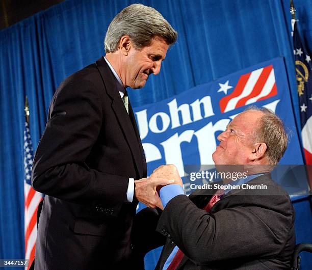 Democratic presidential hopeful U.S. Senator John Kerry greets former Senator from Georgia Max Cleland at a campaign fundraiser April 19, 2004 in...