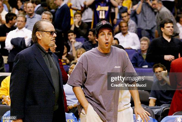 Actors Jack Nicholson and Adam Sandler attend the playoff game between the Los Angeles Lakers and the Houston Rockets on April 19, 2004 in Los...