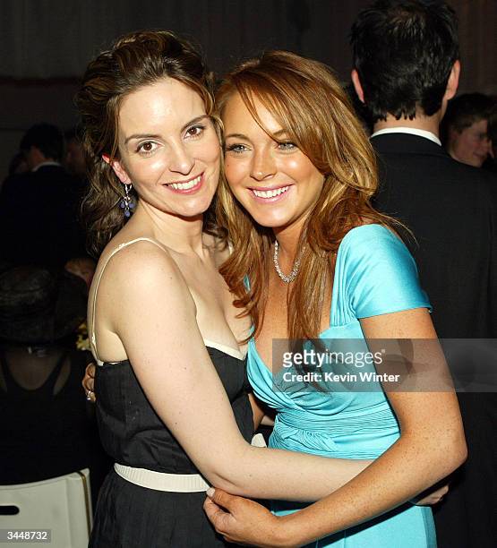 Actress Tina Fey and actress Lindsay Lohan hug at the after-party for Paramount's "Mean Girls" at the Cinerama Dome Theater on April 19, 2004 in Los...