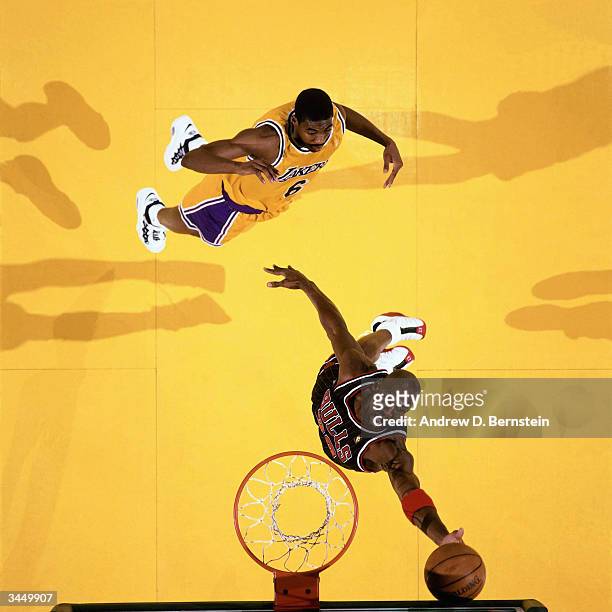 Michael Jordan of the Chicago Bulls grabs a rebound against Eddie Jones of the Los Angeles Lakers during a game on February 5, 1997 at Great Western...
