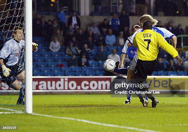 Bruce Dyer of Watford tussles with Darren Ward of Millwall to score their goal during the Nationwide Division One match between Millwall and Watford...