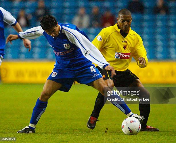 Tim Cahill of Millwall battles with Micah Hyde of Watford during the Nationwide Division One match between Millwall and Watford at The New Den on...