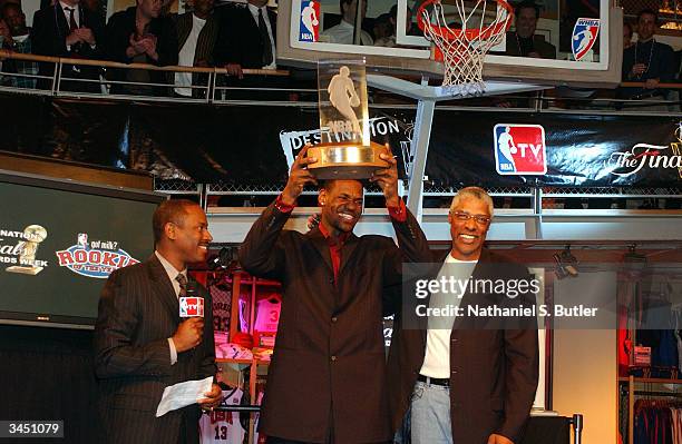 LeBron James of the Cleveland Cavaliers with Julius Erving accepting the Got Milk 2004 Rookie of the Year award at the Destination Finals playoff...