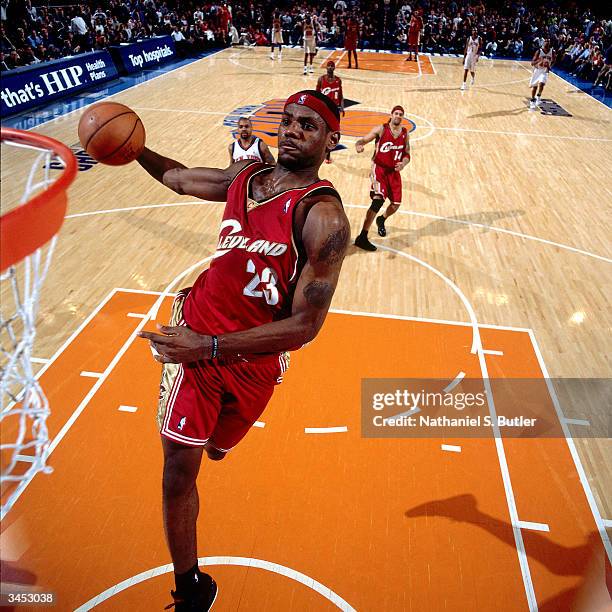 LeBron James of the Cleveland Cavaliers drives to the basket for a dunk against the New York Knicks on April 14, 2004 at Madison Square Garden in New...