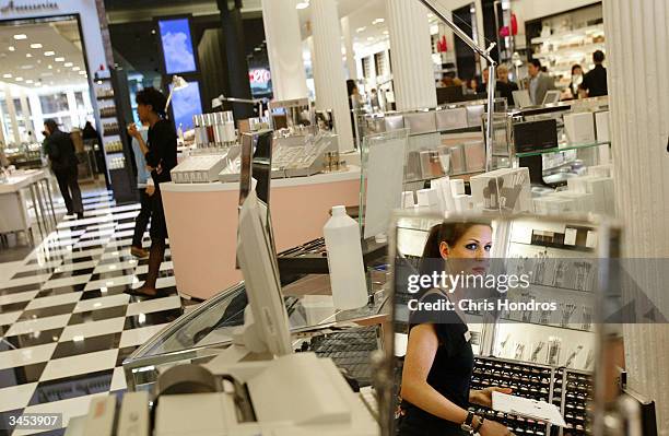 Worker stands behind a counter at the new Bloomingdale's location in the Soho neighborhood April 21, 2004 in New York City. The six level store,...