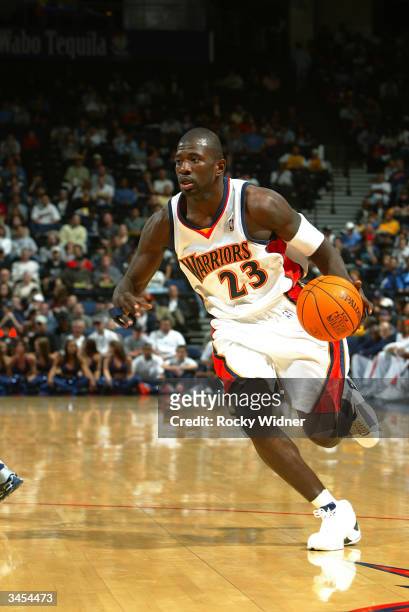 Jason Richardson of the Golden State Warriors drives during the game against the Minnesota Timberwolves at The Arena in Oakland on April 9, 2004 in...