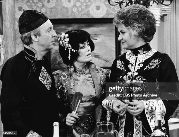 Actors Conrad Bain, Rue McLanahan and Beatrice Arthur wear Asian costumes in a still from the TV series, 'Maude,' 1978.