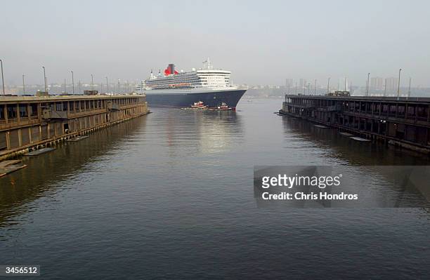 The Queen Mary 2, the world's largest cruise ship, pulls into port April 22, 2004 in New York City. The new flagship of the Cunard line docked in...
