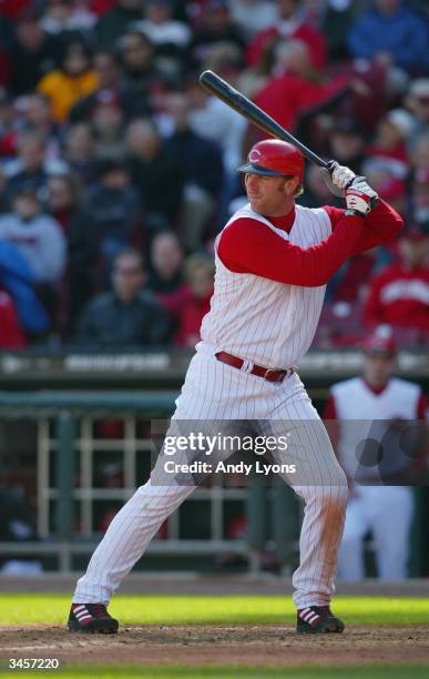 Adam Dunn of the Cincinnati Reds bats during the Reds home opening game against the Chicago Cubs on April 5, 2004 at Great American Ballpark in...