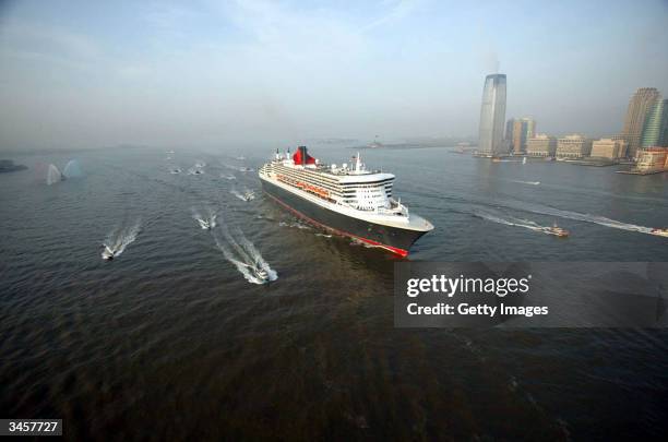 The Queen Mary II, the largest cruise ship in the world, makes her maiden voyage April 22, 2004 in New York Harbor. The Queen Mary II was surrounded...