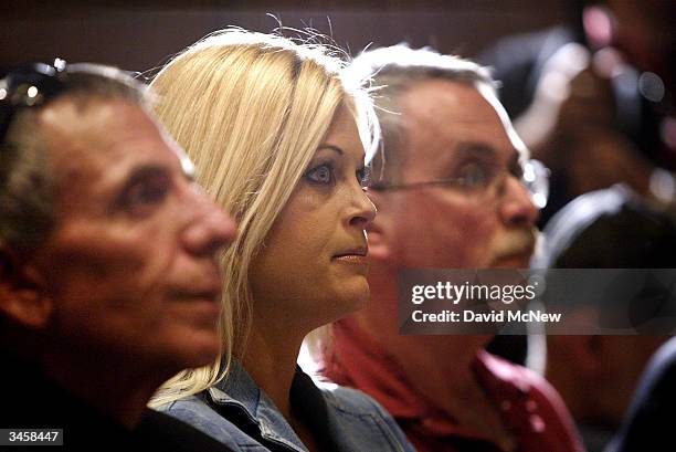 Members of the adult entertainment industry look on during an AIM HealthCare Foundation press conference on the outbreak of the HIV virus in the...