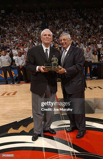 Commissioner David Stern presents Hubie Brown, head coach of the Memphis Grizzlies, with the Red Auerbach trophy for being named 2004 NBA Coach of...