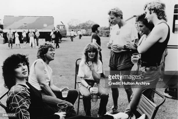 British musician Robert Plant visits members of the rock group Heart after their performance in Milton Keynes, England, circa 1980s. Ann Wilson,...