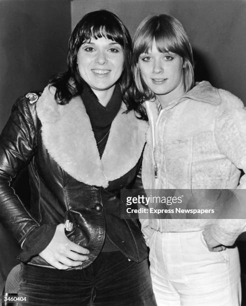 Portrait of sisters Ann and Nancy Wilson of the rock group Heart on tour in Europe, 1976.