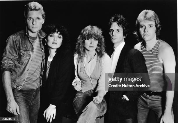 Promotional portrait of the rock group Heart including : Mark Andes, Ann Wilson, Nancy Wilson, Denny Carmassi and Howard Lesse, circa 1980s.