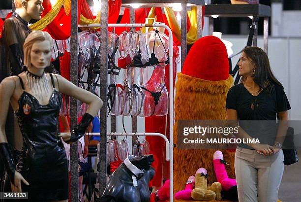 Visitor looks at products in a stand during Erotika Fair, in Sao Paulo, Brazil, late 22 April 2004. The event, the biggest of its kind in Latin...