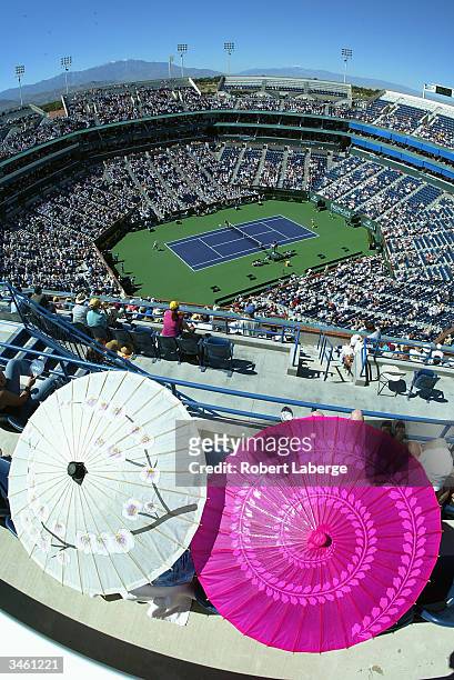 General view of the Stadium Court as Lindsay Davenport of the USA awaits the forehand return shot of Justine Henin-Hardenne of Belgium during the...